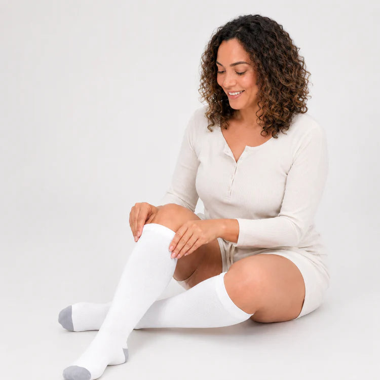 Woman relaxing in Feellow bamboo compression socks