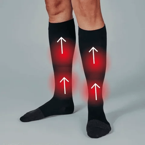 Black compression socks with red highlights and white arrows on a gray background